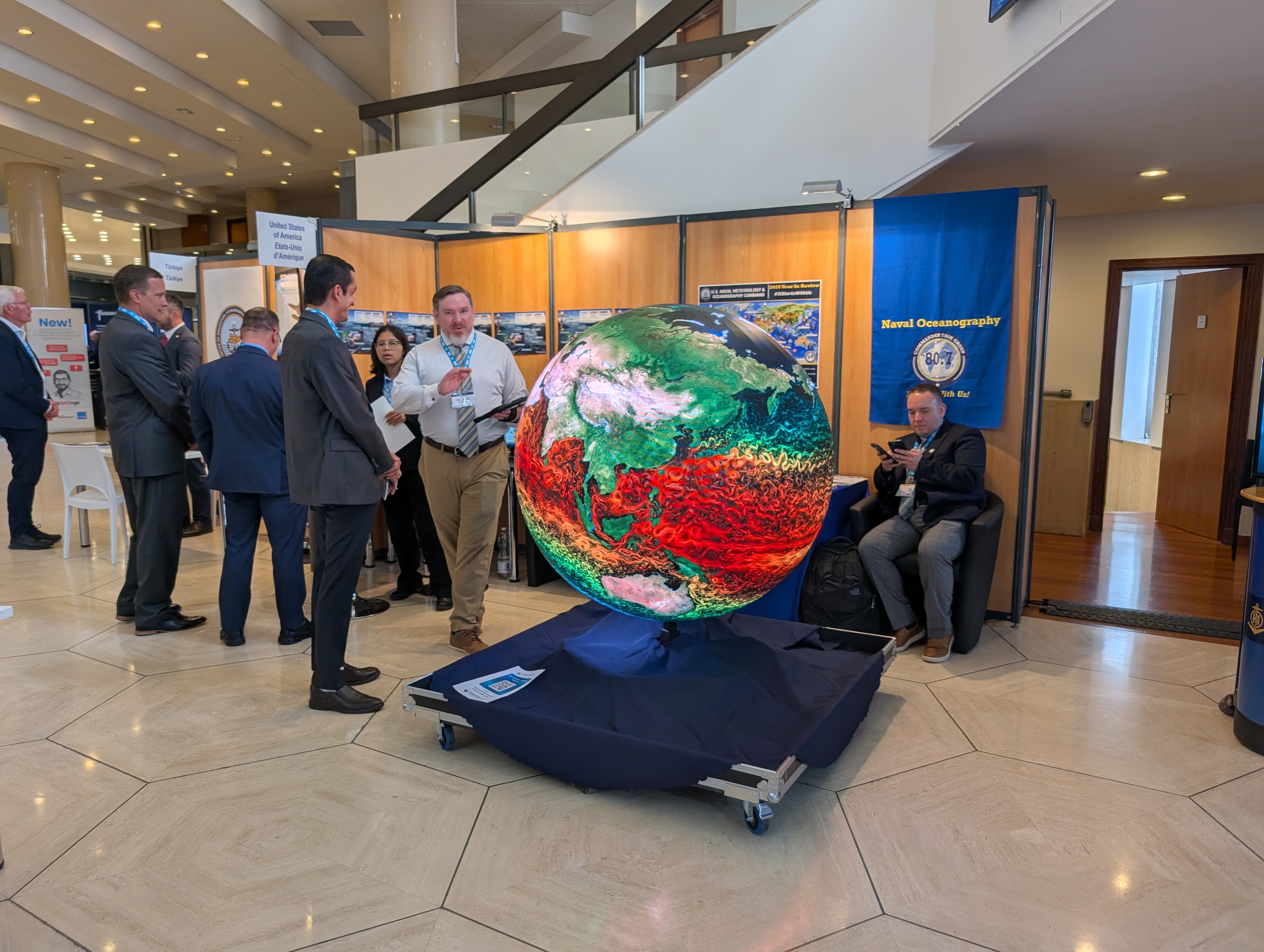 AYNI sphere being demonstrated to a group of delegates