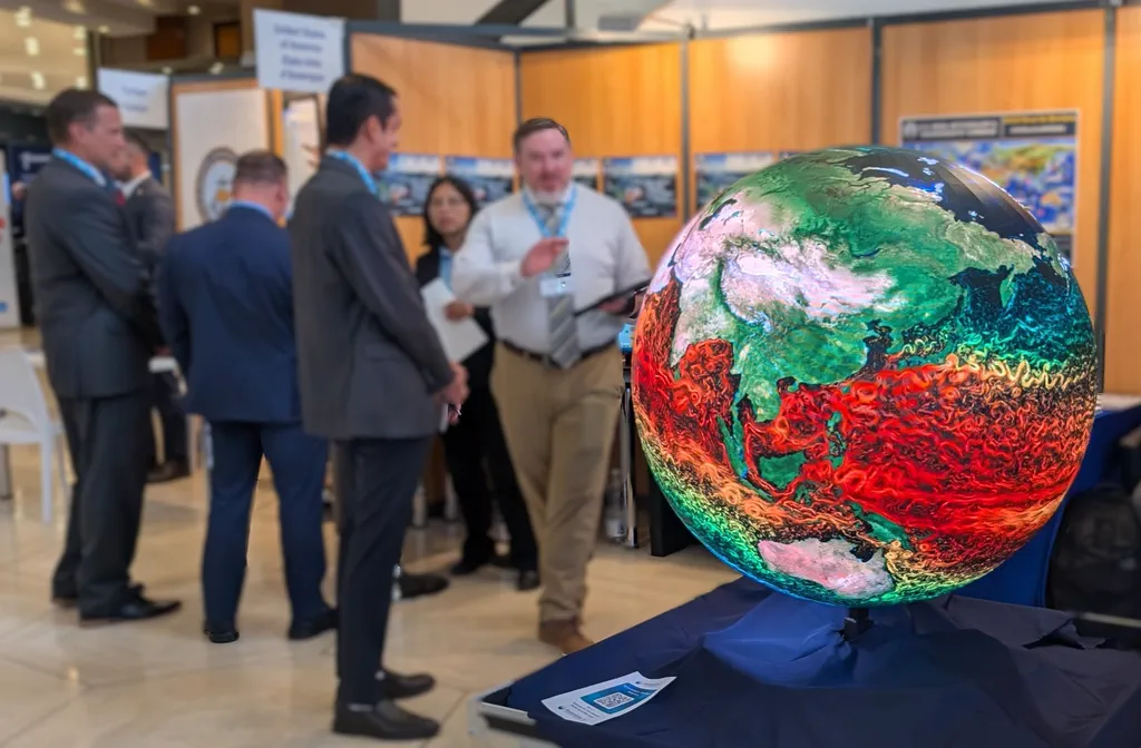 A portable AYNI sphere showing ocean currents at a conference booth